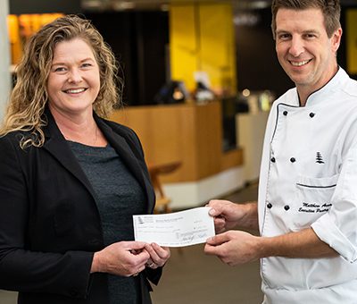 Chef Mathew Arnold and Sonya Keep accepting cheque